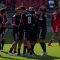 DC United Captain Dwayne De Rosario celebrates a 2-0 win with his teammates against his old team at BMO Field. In the background frustrated Toronto FC forward Ryan Johnson walks off the pitch (JP Dhanoa)